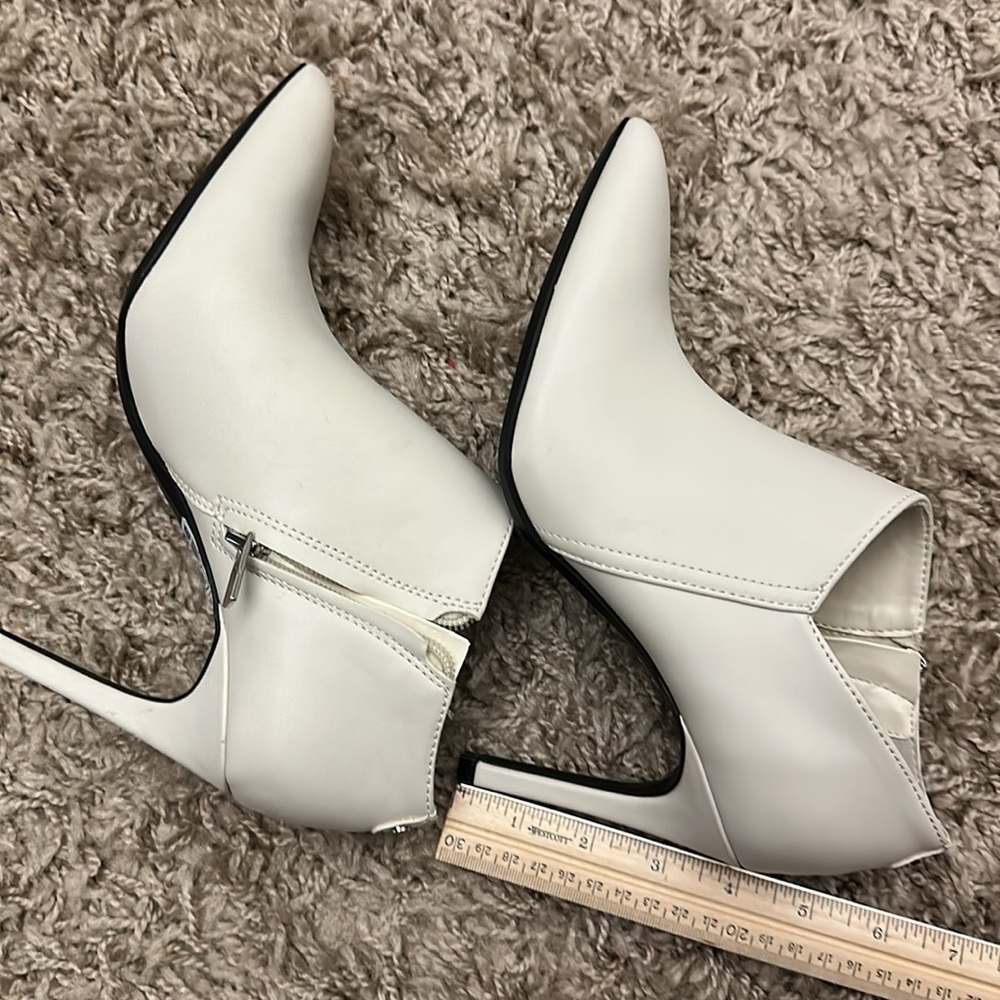 NWOT Calvin Klein ivory ankle booties.